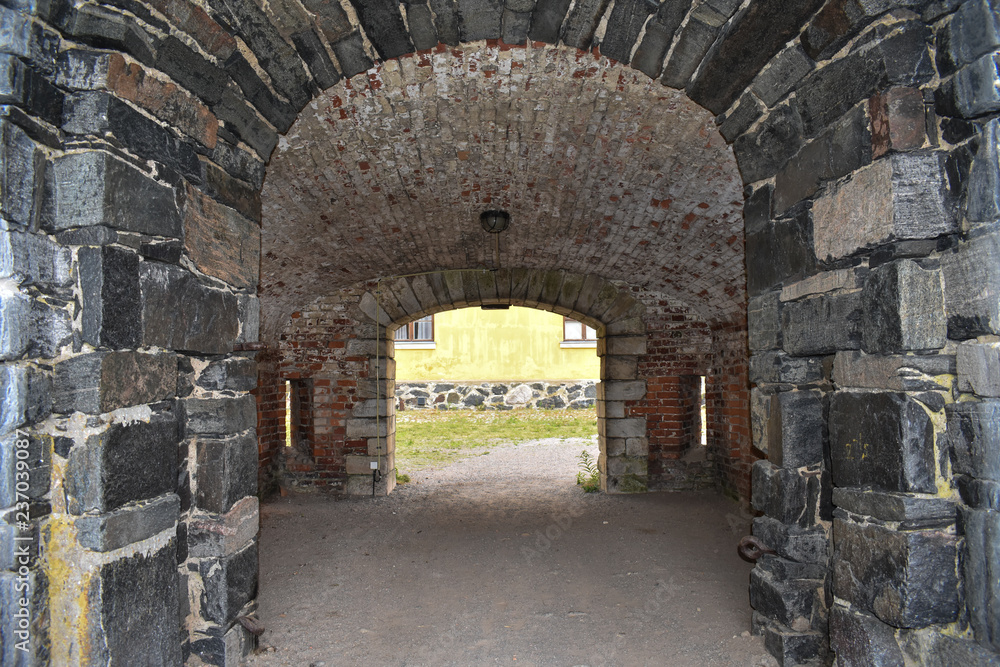 Covered passageway made of rocks and bricks