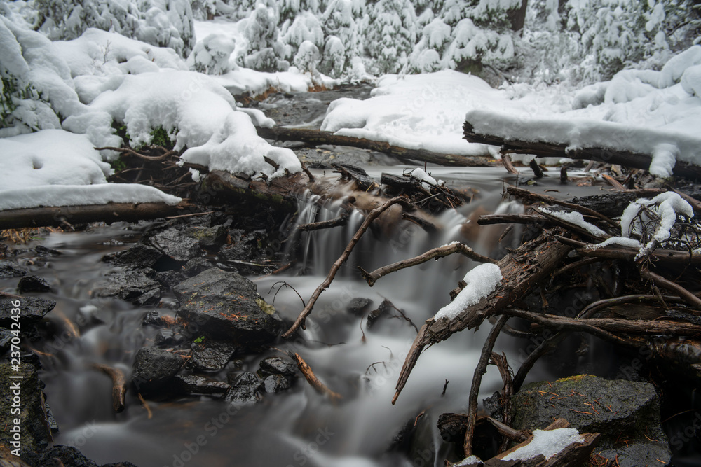 a small waterfall in the early winter a small waterfall in the early winter