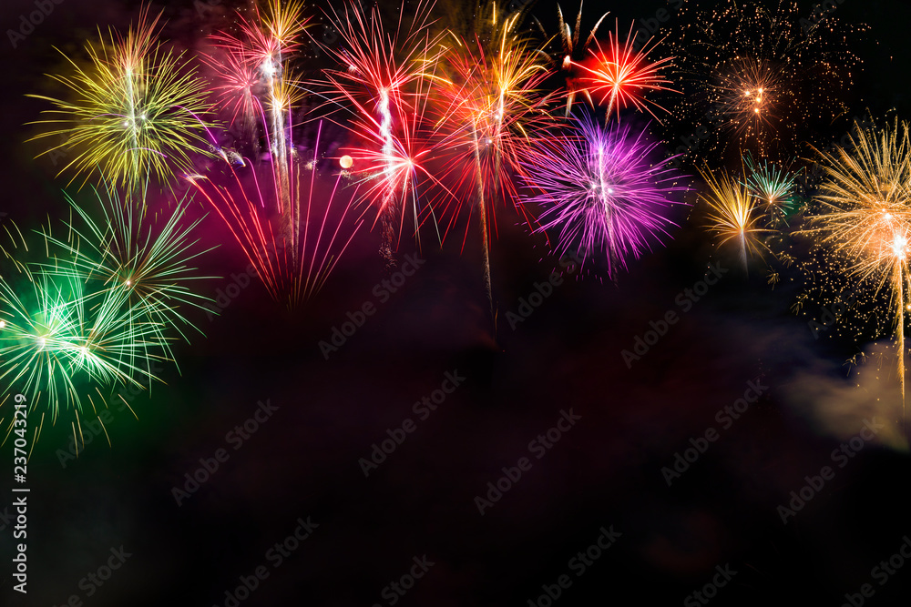 Fireworks display over dark sky