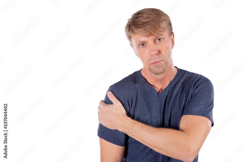 Man holding his sore shoulder trying to relieve pain on white background. Health problems Man holding his sore shoulder trying to relieve pain on white background. Health problems