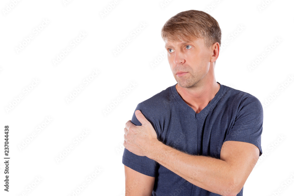 Man holding his sore shoulder trying to relieve pain on white background. Health problems Man holding his sore shoulder trying to relieve pain on white background. Health problems
