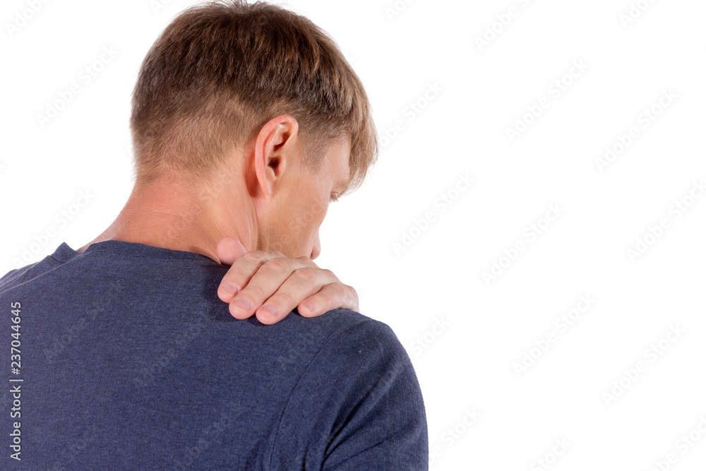 Man holding his sore shoulder trying to relieve pain on white background. Health problems Man holding his sore shoulder trying to relieve pain on white background. Health problems