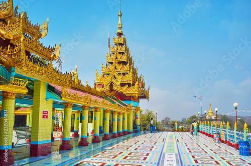 The brightly colored buildings of Soon Oo Ponya Shin Paya (Summit Pagoda) with golden pyatthat roofs, tiled columns and floor with geometric patterns, on February 21 in Sagaing photo