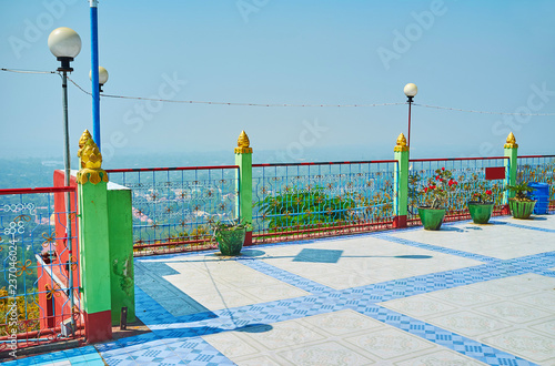 The viewpoint balcony of Soon Oo Ponya Shin Paya, overlooking the foot of Sagaing Hill with deep forests, numerous historic temples, shrines and foggy Ayeyarwady river on background, Myanmar. photo