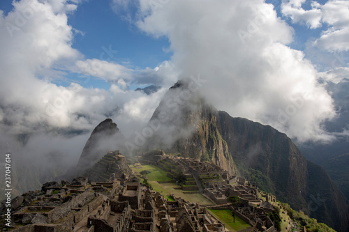 Panorama of the Machu Picchu or Machu Pikchu panoramic view in Peru. Machu Picchu is a Inca site located in the Cusco Region in Peru. Machu Picchu is one of the New Seven Wonders of the World