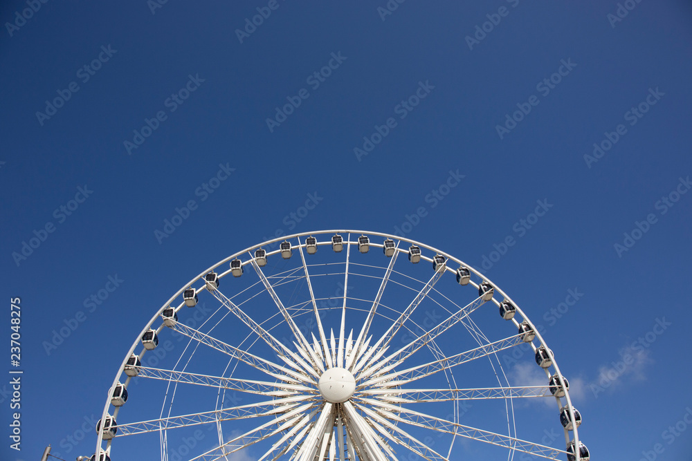 Shot with the sun still low in the sky it gives the Liverpool Ferris Wheel a white and gold glow which looks really cool