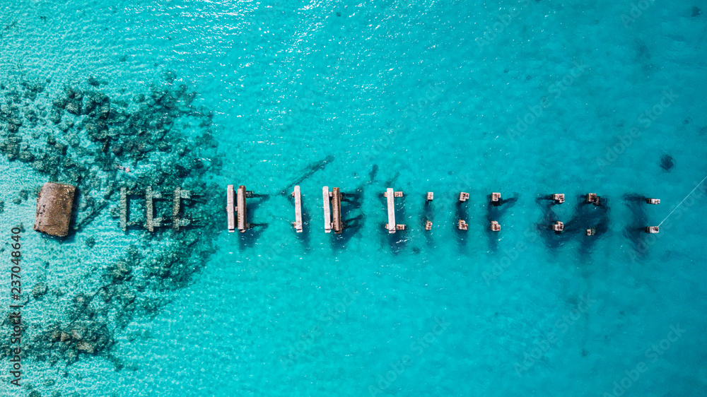 Aerial drone view of Saona Island in Punta Cana, Dominican Republic with reef, trees and beach in a tropical landscape with boats and vegetation