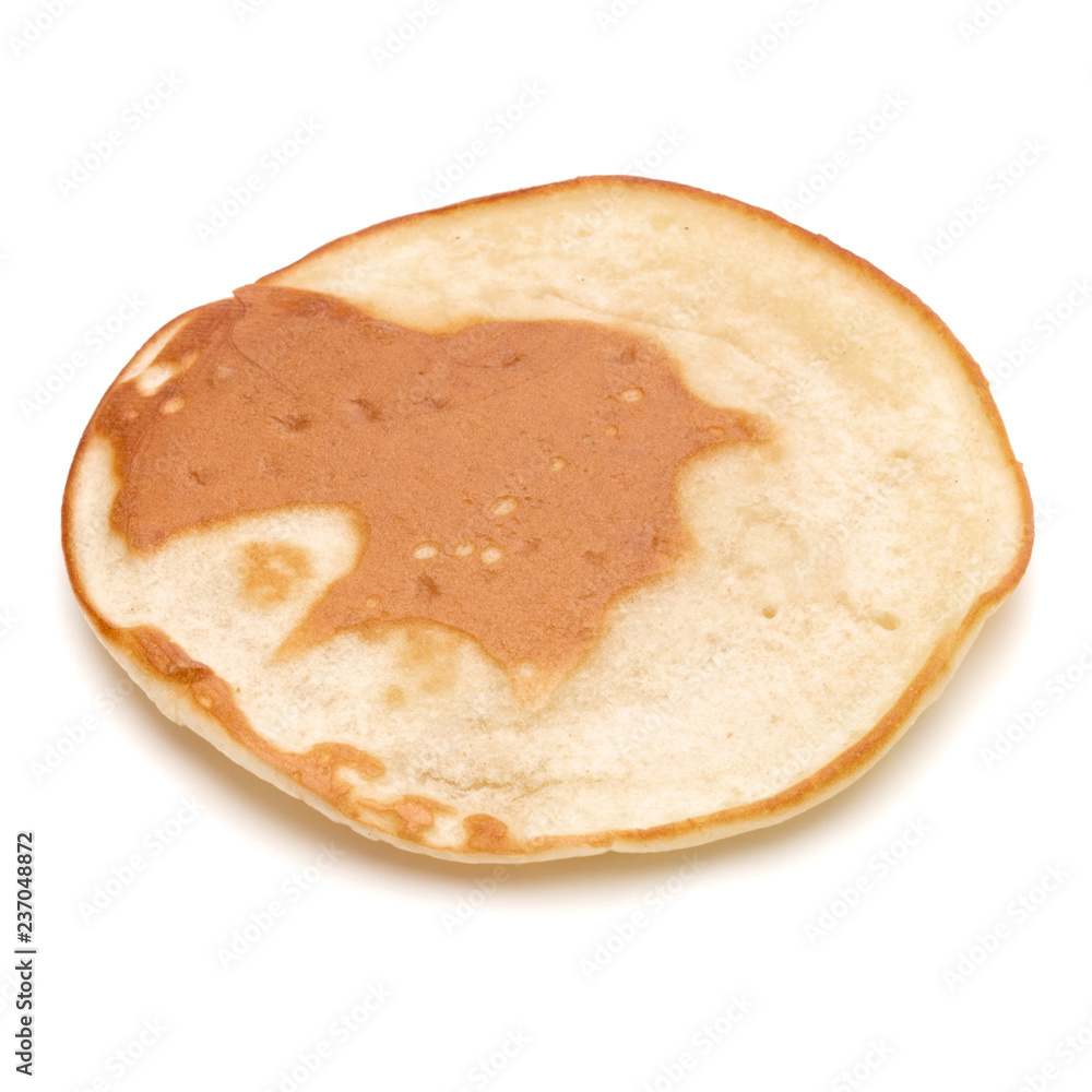 One pancake isolated on white background cutout. One pancake isolated on white background cutout.