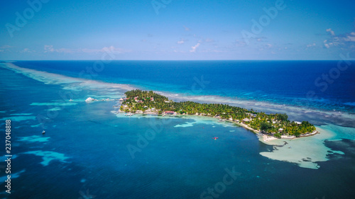 Aerial Drone view of South Water Caye tropical island in Belize barrier reef. A typical Caribbean island with turquoise water