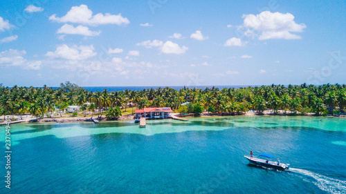 Aerial Drone view of South Water Caye tropical island in Belize barrier reef. A typical Caribbean island with turquoise water photo