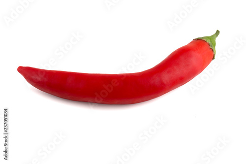 Chili peppers on a white background. Fresh chili pepper close up. One red pepper on a white background.