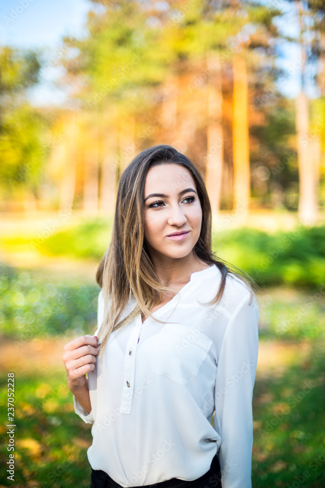 Photographing a girl during autumn with a blurred background Photographing a girl during autumn with a blurred background
