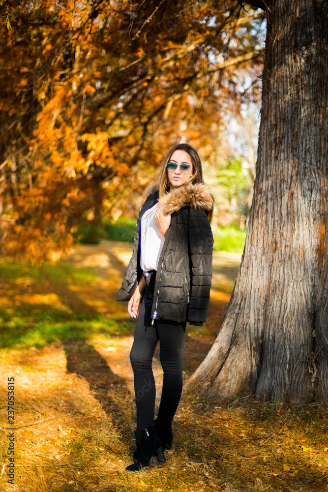 Photographing a girl during autumn with a blurred background Photographing a girl during autumn with a blurred background