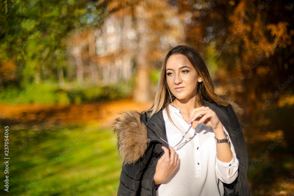 Photographing a girl during autumn with a blurred background Photographing a girl during autumn with a blurred background
