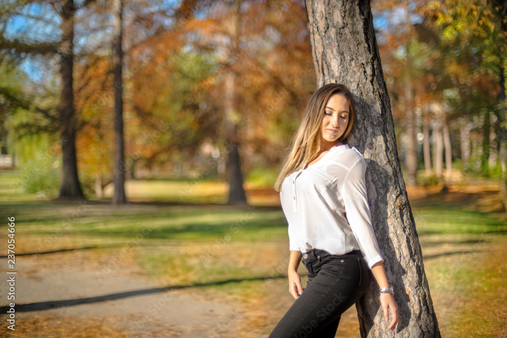 Photographing a girl during autumn with a blurred background Photographing a girl during autumn with a blurred background