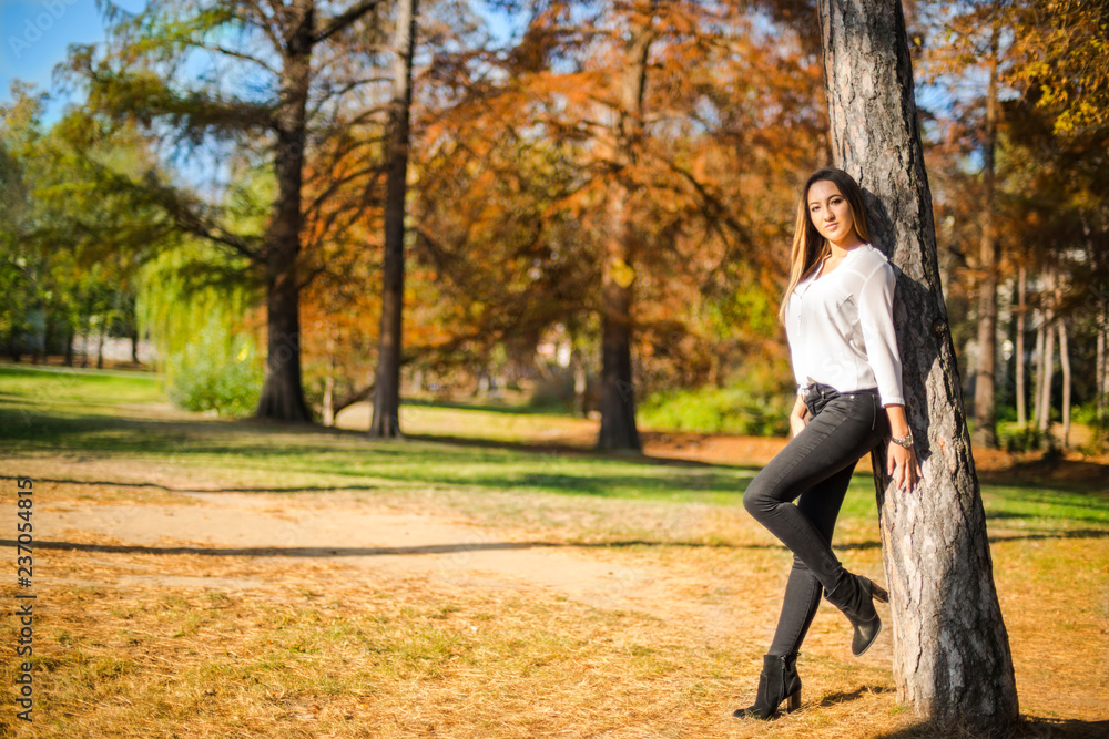 Photographing a girl during autumn with a blurred background Photographing a girl during autumn with a blurred background