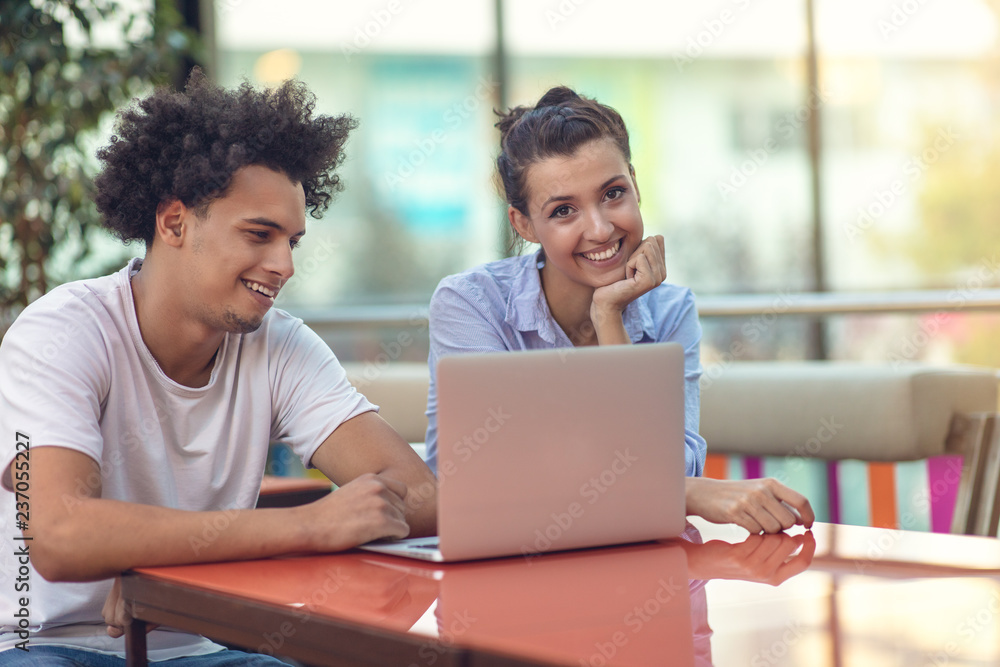 Two freelance working in coffee shop, Nomad worker conceptual, couple work together in cafe with laptop Two freelance working in coffee shop, Nomad worker conceptual, couple work together in cafe with laptop