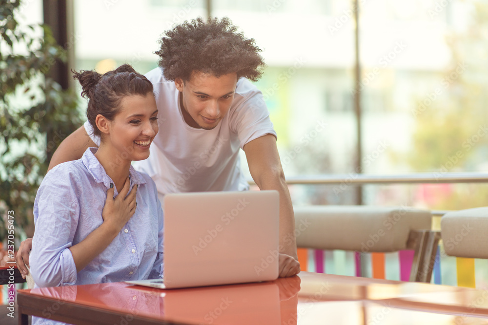 Two freelance working in coffee shop, Nomad worker conceptual, couple work together in cafe with laptop Two freelance working in coffee shop, Nomad worker conceptual, couple work together in cafe with laptop