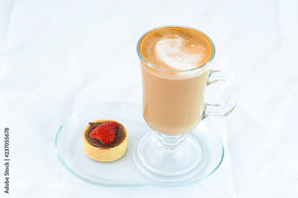 Cafe latte with small strawberry tart with isolated white background