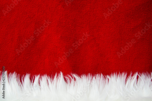 Border of white fur over festive red brocade. Lots of copy-space. Santa Claus.