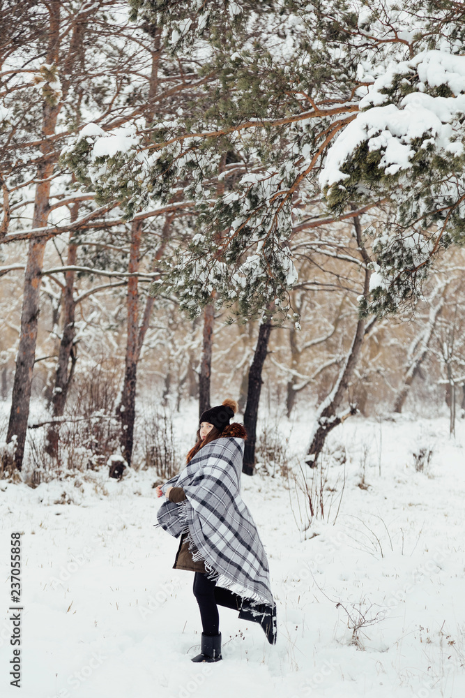 girl in winter in a plaid plaid