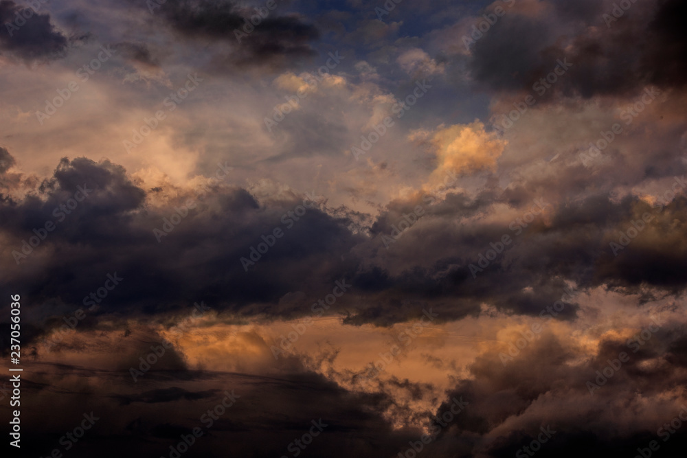 sunset sky with dark clouds close up - texture