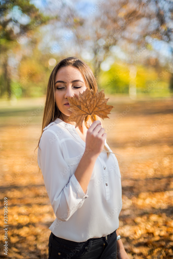 Photographing a girl during autumn with a blurred background Photographing a girl during autumn with a blurred background