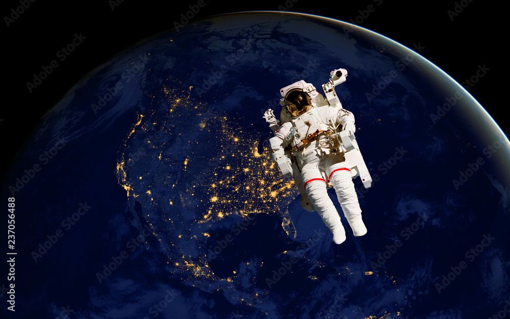 astronaut spacewalk at night from the dark side of the earth planet. Elements of this image furnished by NASA d