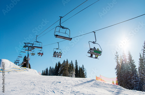 Photos Low angle shot of a ski lift at ski resort Bukovel in the mountains on a sunny winter day