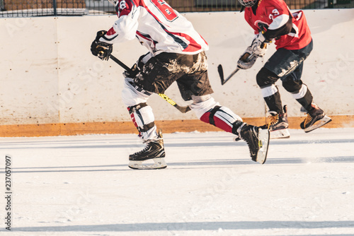 ice hockey match, players of both teams compete on the championship f