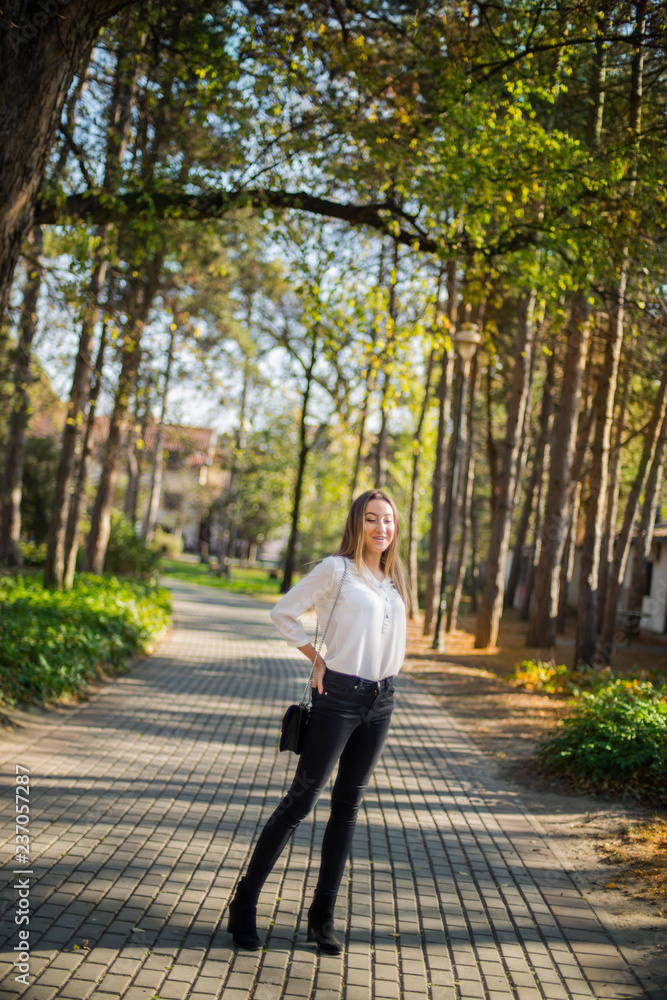 Photographing a girl during autumn with a blurred background Photographing a girl during autumn with a blurred background
