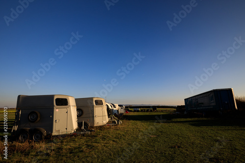 Horse transport boxes standing on a field