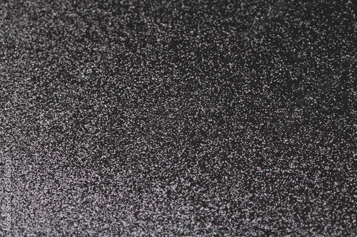 Black glitter texture for shiny christmas background.