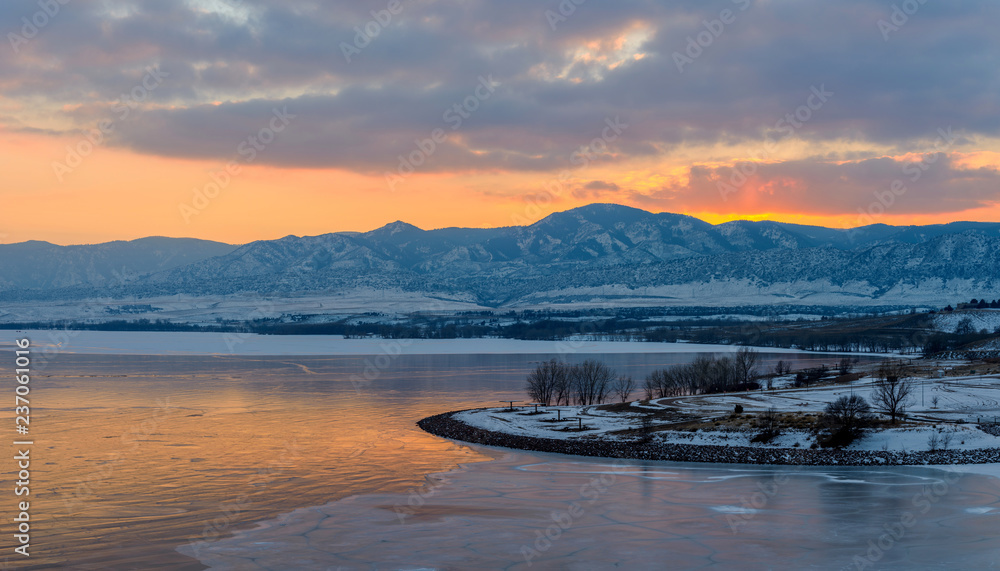 Sunset Ice Lake - A winter sunset scene at frozen Chatfield Reservoir in Chatfield State Park, Littleton, Colorado, USA.