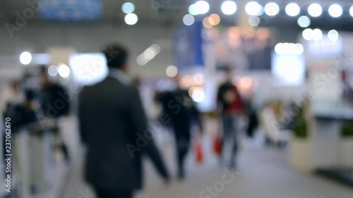 Wallpaper Mural Abstract Defocused Blurred Background flow of many people inside space shopping center or mall, exhibition, exposition, hall real time. Torontodigital.ca