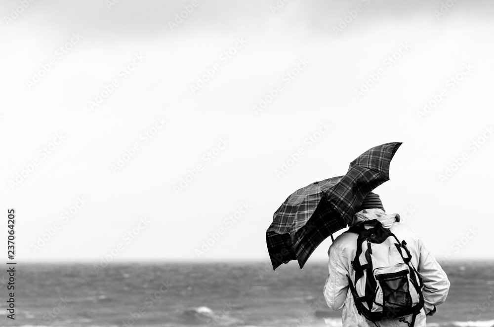 peoble with umbrella with strong weather 