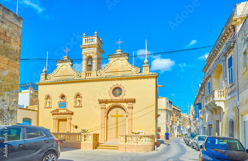 The small chapel of Santa Lucia with low bell tower located in same named street in old town of Naxxar, Malta photo