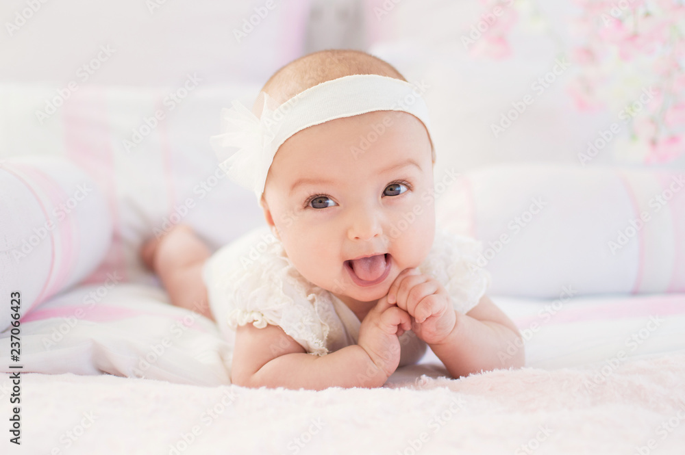 Portrait of a crawling baby on a bed in his room. The concept of a happy child. Diapers. Portrait of a crawling baby on a bed in his room. The concept of a happy child. Diapers.