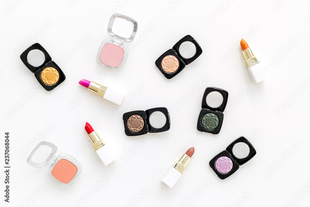 Professional cosmetics set with palette of eyeshadows on white background top view Professional cosmetics set with palette of eyeshadows on white background top view