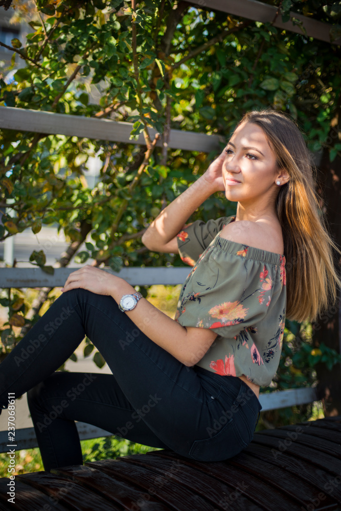 Photographing a girl during autumn with a blurred background Photographing a girl during autumn with a blurred background
