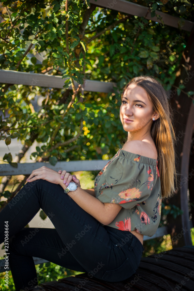 Photographing a girl during autumn with a blurred background Photographing a girl during autumn with a blurred background