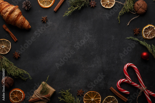 Christmas composition in rustic style on a black background. Top view. Copy space.