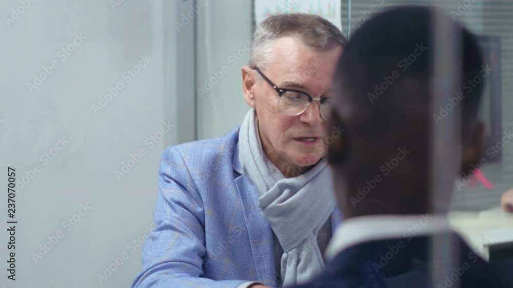 Caucasian mature man in travel agency Caucasian mature man in travel agency