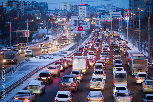 Traffic jam during a snowfall in Vladivostok © alexhitrov