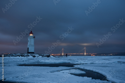 Aerial winter view of the Tokarevskiy lighthouse - one of the oldest lighthouses in the Far East, still an important navigational structure and popular attractions of Vladivostok city, Russia. 