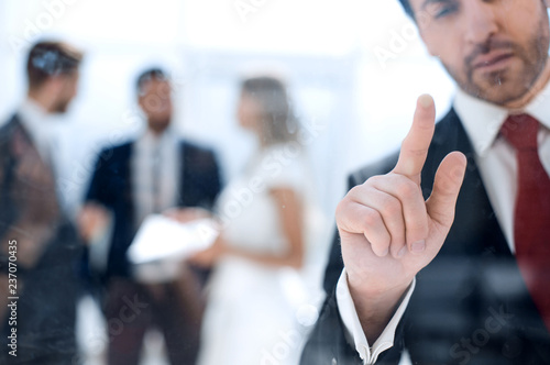 close up.thoughtful businessman standing near a transparent Boar