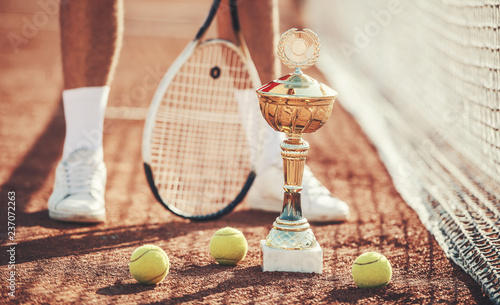 Tennis champion. Tennis player on the court, close up photo. Sport, recreation concept © bobex73