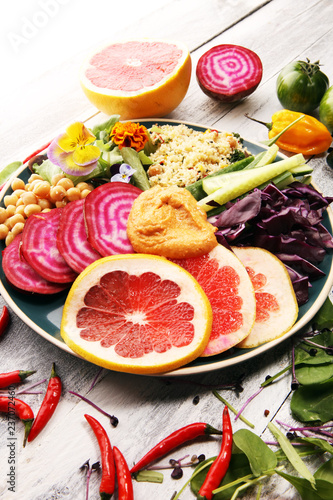 Bowl of Buddha  The concept of a healthy diet  chickpeas  salad  beetroot  pumpkin  cucumber  grapefruit  cabbage and tabouleh. Balanced food.