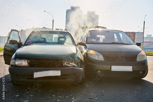 car crash accident on street. damaged automobiles with triggered air bag © Kadmy