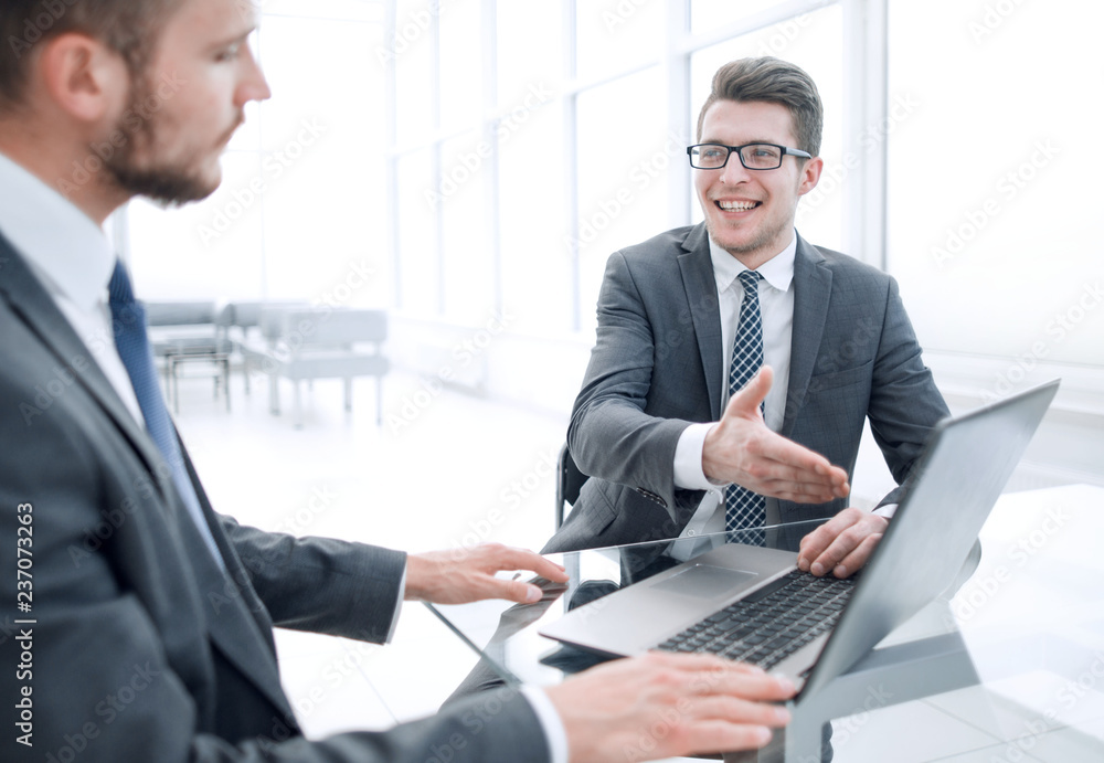 Fototapeta premium close up.business partners discuss information sitting at the office table